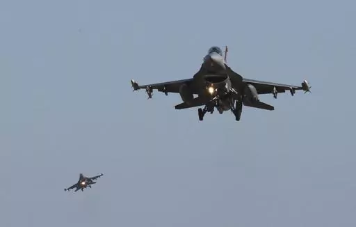 U.S. Air Force F-16 fighter jets fly over the Osan U.S. Air Base during a combined air force exercise with the United States and South Korea in Pyeongtaek, South Korea, Dec. 4, 2017. The U.S. has once again buckled under pressure from European allies and Ukraine's leaders and agreed to provide more sophisticated weapons to the war effort. This time it's all about F-16 fighter jets. (AP Photo/Ahn Young-joon, File)