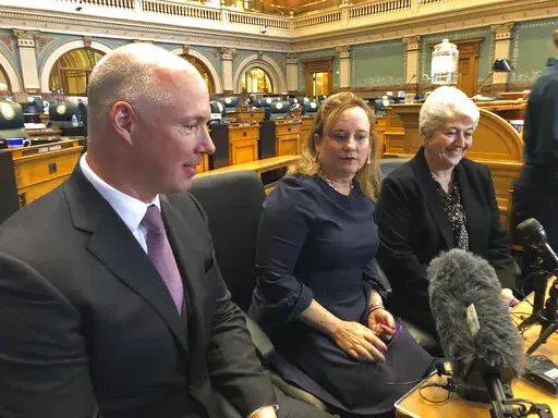 Colorado Republican Sen. Kevin Priola, left, Democratic House Speaker KC Becker, center, and Democratic Sen. Lois Court discuss a proposed ballot initiative to let the state keep excess tax revenue in Denver on March 20, 2019. Citing alarm toward the Republican Party's widespread embrace of 2020 election conspiracies, a moderate GOP Colorado state senator has switched his affiliation to Democrat. Priola's decision, announced on Monday, Aug. 22, 2022, enhances Democrats' chances of retaining thei