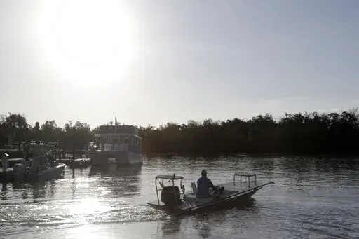A boat heads out from the Flamingo boat ramp May 4, 2020, in Everglades National Park in Florida. Home-district projects for members of Congress are back, sprinkled across the government-wide $1.5 trillion bill President Joe Biden signed recently, including $350 million to help restore Florida’s vast but imperiled Everglades. (AP Photo/Lynne Sladky, File)