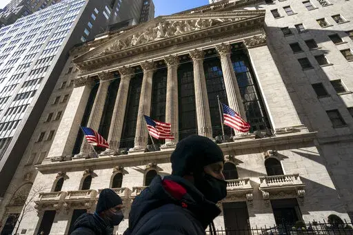 A pedestrian passes the New York Stock Exchange, Monday, Jan. 24, 2022, in New York. The stock market is losing crucial support from the Federal Reserve. Omicron is causing havoc at businesses around the world. And Russia just might be preparing to invade Ukraine, creating more uncertainty and raising the prospect of even higher oil prices. (AP Photo/John Minchillo, File)
