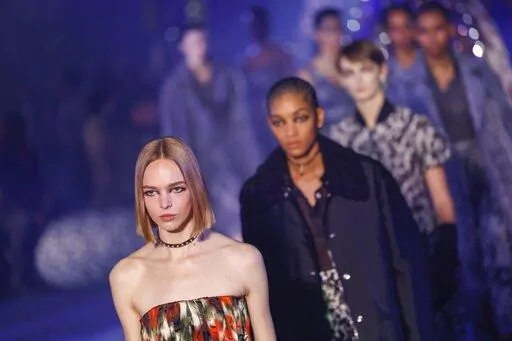 Models wear creations as part of the Christian Dior Fall/Winter 2023-2024 ready-to-wear collection presented Tuesday, Feb. 28, 2023 in Paris. (Vianney Le Caer/Invision/AP)