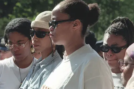 Malcolm X's daughters Malikah Shabazz, left, Attallah Shabazz, second from left, Malaak Shabazz, third from left, and Gamilah Shabazz, talk to the media outside the Jacobi Medical Center in the Bronx borough of New York, following the death of their mother, Betty Shabazz, June 23, 1997. (AP Photo/Ron Frehm, File)