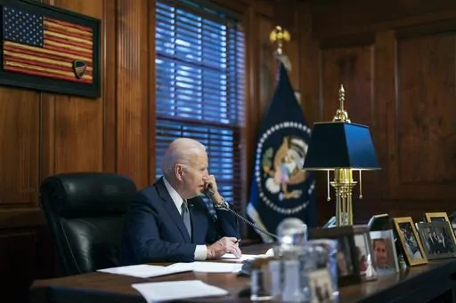 In this image provided by The White House, President Joe Biden speaks with Russian President Vladimir Putin on the phone from his private residence in Wilmington, Del., Dec. 30, 2021. Biden's sprawling home outside downtown Wilmington, has a special place in his heart. When he met special prosecutor Robert Hur to talk about the sensitive documents he’d improperly kept after his vice presidency, Biden told Hur three times he is a “frustrated architect.” (Adam Schultz/The White House via AP,