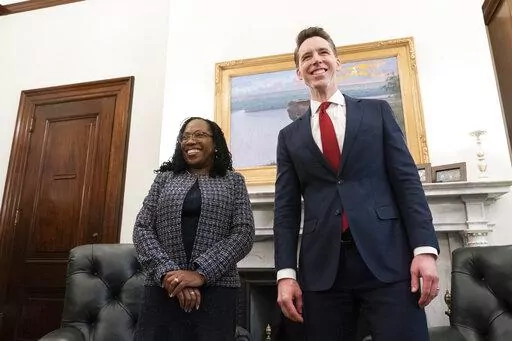 Supreme Court nominee Judge Ketanji Brown Jackson, left, and Sen. Josh Hawley, R-Mo., stand before their meeting on Capitol Hill, March 9, 2022, in Washington. Judge Jackson's confirmation hearing starts March 21. If confirmed, she would be the court's first Black female justice. (AP Photo/Alex Brandon, File)