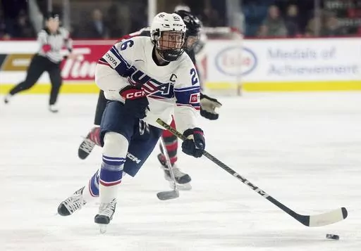 United States' Kendall Coyne Schofield skates with the puck against Canada during the first period of a Rivalry Series hockey game Nov. 17, 2022, in Kamloops, British Columbia. Coyne Schofield, a three-time Olympian and former U.S. captain, will suit up for Minnesota’s Professional Women's Hockey League opener at Boston on Jan. 3. The game will underline Coyne Schofield’s determination in returning to competitive play, after the birth of her son, now 6 months old. (Jesse Johnston/The Canadia
