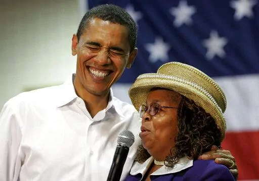 Presidential hopeful Sen. Barack Obama, D-Ill., left, laughs with Greenwood County, S.C., Council Woman, Edith Childs, right, in Aiken, S.C., on Oct. 6, 2007. Obama is marking the retirement of the South Carolina woman credited with popularizing the chant "Fired up, ready to go!" The chant came to epitomize Obama's two presidential campaigns. The former president says Childs' energy played a key role in lifting his spirits and his candidacy. (AP Photo/Brett Flashnick, File)