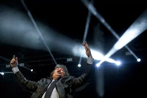 Presidential candidate of the Liberty Advances coalition Javier Milei waves to supporters during a campaign rally in Buenos Aires, Argentina, Wednesday, Oct. 18, 2023. General elections are set for Oct. 22. (AP Photo/Natacha Pisarenko)