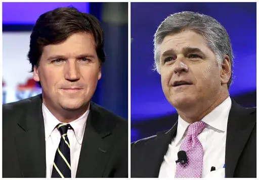 This combination photo shows, from left, Tucker Carlson, host of "Tucker Carlson Tonight," and Sean Hannity, host of "Hannity" on Fox News. Several conservative media figures in the United States, including Carlson and Hannity, have taken up the cause of Canadian truckers who have occupied parts of Ottawa and blocked border crossings to protest COVID-19 restrictions and vaccine mandates. (AP Photo/File)