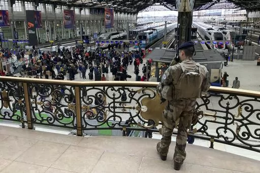 A soldier patrols inside the Gare de Lyon station after an attack, Saturday, Feb. 3, 2024 in Paris. A man injured three people Saturday in a stabbing attack at the major Gare de Lyon train station in Paris, another nerve-rattling security incident in the Olympic host city before the Summer Games open in six months. (AP Photo/Christophe Ena)