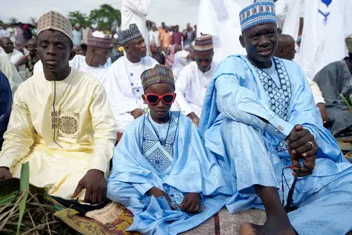 A Muslim boy performs Eid al-Fitr prayers, marking the end of the fasting month of Ramadan in Lagos, Nigeria, Sunday, March 30, 2025. (AP Photo/Sunday Alamba)