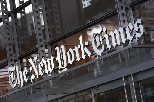 A sign for The New York Times hangs above the entrance to its building, Thursday, May 6, 2021 in New York. The New York Times filed a federal lawsuit against OpenAI and Microsoft on Wednesday, Dec. 27, 2023 seeking to end the practice of using published material to train chatbots. (AP Photo/Mark Lennihan, File)