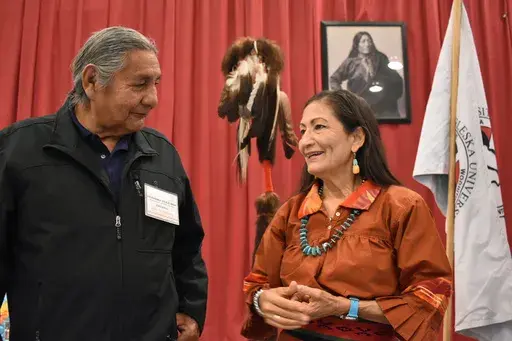 Russell Eagle Bear, with the Rosebud Sioux Reservation Tribal Council, talks to U.S. Interior Secretary Deb Haaland during a meeting about Native American boarding schools at Sinte Gleska University in Mission, S.D., on Oct. 15, 2022. (AP Photo/Matthew Brown, File)