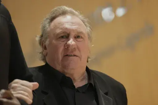 French actor Gerard Depardieu leaves for a break during his trial for the alleged sexual assaults of two women on a film set in 2021, Wednesday, March 26, 2025 in Paris. (AP Photo/Aurelien Morissard)