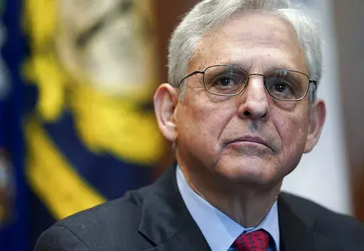 Attorney General Merrick Garland listens during a meeting of the COVID-19 Fraud Enforcement Task Force at the Justice Department, March 10, 2022 in Washington. The lawmakers investigating the Jan. 6 attack on the Capitol have been increasingly using their public statements, court filings and committee reports to deliver a blunt message to Garland and the Department of Justice to act on their findings. (Kevin Lamarque/Pool Photo via AP, File)