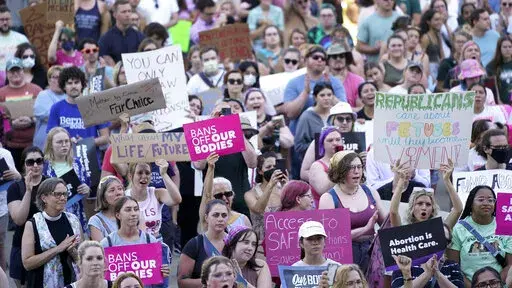 Abortion rights protesters attend a rally outside the state Capitol in Lansing, Mich., on June 24, 2022, following the United States Supreme Court's decision to overturn Roe v. Wade. Judge Elizabeth Gleicher, of the Court of Claims, on Wednesday, Sept. 7, 2022, struck down Michigan's 1931 anti-abortion law, months after suspending it. Judge Gleicher said the law, long dormant before U.S. Supreme Court overturned Roe v. Wade in June, violates the Michigan Constitution. (AP Photo/Paul Sancya, File