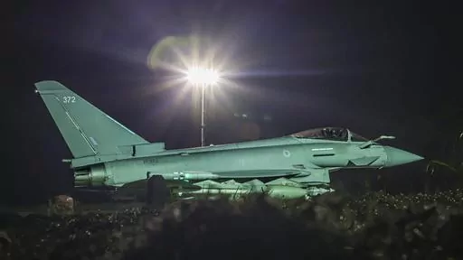 This photo issued by the Ministry of Defence (MOD) on Sunday, Feb. 4, 2024 shows a RAF Typhoon FGR4 aircraft returning to the base, following strikes against Houthi targets in Yemen. The U.S. and Britain struck 36 Houthi sites in Yemen in a second wave of assaults meant to further disable Iran-backed groups that have relentlessly attacked American and international interests in the wake of the Israel-Hamas war. In addition to the strikes on Saturday, U.S. Central Command says it conducted an add