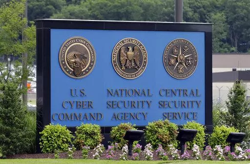 A sign stands outside the National Security Administration (NSA) campus on in Fort Meade, Md., on June 6, 2013. The national reckoning over racial inequality sparked by George Floyd's murder two years ago has gone on behind closed doors inside America's intelligence agencies. Shortly after his death, employees of the National Security Agency had a call to speak to their director about racism and cultural misunderstandings. One by one, officers spoke about examples of racism that they had seen in