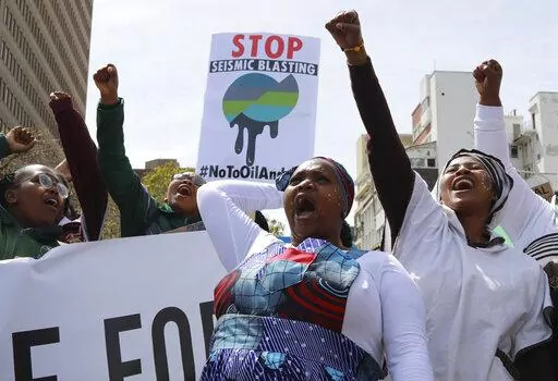 Environmental activists take part in a protest calling for the government to take immediate action against climate change in Cape Town, South Africa, Sept. 24, 2022. Young climate activists from African nations have high demands but low expectations for the U.N. climate conference which begins Sunday, Nov. 6, in the Egyptian coastal resort of Sharm el-Sheikh. (AP Photo/Nardus Engelbrecht, File)