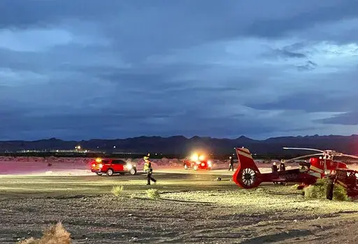 This image provided by Boulder City communications manager Lisa LaPlante shows a Grand Canyon tour helicopter after a Tuesday, Dec. 27, 2022, crash described as a "hard landing" at Boulder City, Nev., Municipal Airport. Officials say the pilot and six passengers were taken to Las Vegas-area hospitals with injuries that were not life-threatening. (Lisa LaPlante/Boulder City via AP)