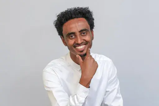 Freelance video journalist Amir Aman Kiyaro, who is accredited to The Associated Press and has been in detention since November 2021 without charges, poses for a photograph in Ethiopia on Oct. 17, 2021. Kiyaro was freed on bail Friday, April 1, 2022 after the country's Supreme Court on Thursday upheld the ruling to grant him bail, rejecting a police effort to block his release. (AP Photo, File)