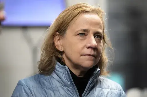 Joyce Craig, Democratic candidate for governor, listens to workers during a visit to the Milan Lumber mill, Wednesday, Oct. 16, 2024, in Milan, N.H. (AP Photo/Robert F. Bukaty)