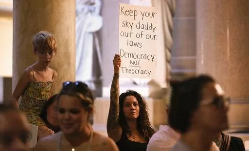 Demonstrators stand outside the House chamber before a vote is held on Senate Bill 1 during a special session Friday, Aug. 5, 2022, at the Indiana Statehouse in Indianapolis. Critics of religious freedom laws often argue they are used to discriminate against LGBTQ people and only protect a conservative Christian worldview. But following the U.S. Supreme Court’s overturning of Roe v. Wade in June, religious abortion-rights supporters are using these laws to protect access to abortion and defend