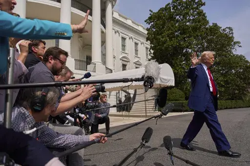 President Donald Trump walks to board Marine One after speaking with reporters on the South Lawn of the White House, April 3, 2025, in Washington. (AP Photo/Evan Vucci)