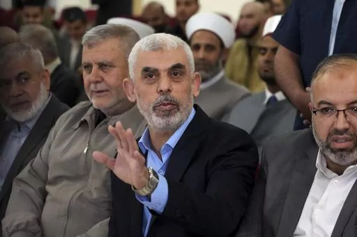 Yahya Sinwar, head of Hamas in Gaza, greets his supporters upon his arrival at a meeting in a hall on the sea side of Gaza City, on April 30, 2022. Since Hamas fighters carried out the deadliest attack on Israel in decades, Israeli officials have vowed to crush the Palestinian militant group and its enigmatic leader in Gaza, Yahya Sinwar. But seven weeks into the war, 61-year-old Sinwar remains alive, in hiding and at the helm of Hamas’ fighters as they battle Israeli forces. (AP Photo/Adel Ha