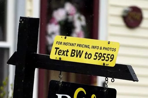 A sign is displayed outside a home in Wheeling, Ill., Thursday, May 5, 2022. Sometimes hosts offering to rent their vacation home, RV or car through peer-to-peer sharing sites don’t show up at the time they promised to exchange keys. If you can’t get in contact with them, you might have been “ghosted,” leaving you stranded. (AP Photo/Nam Y. Huh, File)