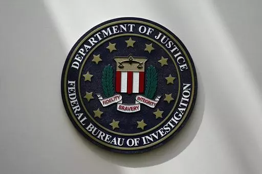 The FBI seal is pictured in Omaha, Neb., Aug. 10, 2022. FBI officials repeatedly violated their own standards when they searched a vast repository of foreign intelligence for information related to the insurrection at the U.S. Capitol on Jan. 6, 2021, and racial justice protests in 2020. That's according to a heavily blacked-out court order released Friday, May 19, 2023. FBI officials said the violations predated a series of corrective measures that started in the summer of 2021 and continued la