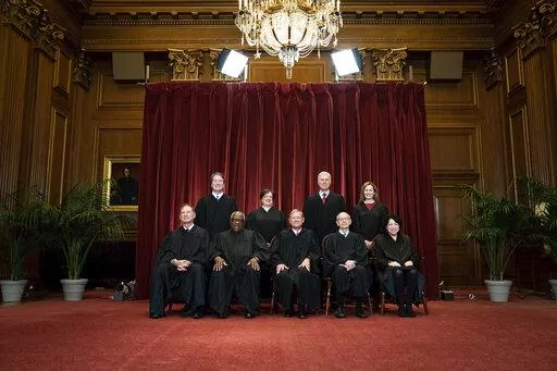Members of the Supreme Court pose for a group photo at the Supreme Court in Washington, April 23, 2021. Seated from left are Associate Justice Samuel Alito, Associate Justice Clarence Thomas, Chief Justice John Roberts, Associate Justice Stephen Breyer and Associate Justice Sonia Sotomayor, Standing from left are Associate Justice Brett Kavanaugh, Associate Justice Elena Kagan, Associate Justice Neil Gorsuch and Associate Justice Amy Coney Barrett. Judge Ketanji Brown Jackson will join a Supreme