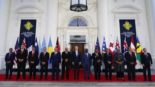 President Joe Biden, center, poses for a photo with Pacific Island leaders on the North Portico of the White House in Washington, Thursday, Sept. 29, 2022. From left, New Caledonia President Louis Mapou, Tonga Prime Minister Siaosi Sovaleni, Palau President Surangel Whipps Jr., Tuvalu Prime Minister Kausea Natano, Micronesia President David Panuelo, Fiji Prime Minister Josaia Voreqe Bainimarama, Biden, Solomon Islands Prime Minister Manasseh Sogavare, Papua New Guinea Prime Minister James Marape