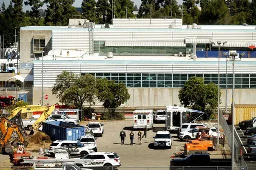 Law enforcement officers respond to the scene of a shooting at a Santa Clara Valley Transportation Authority (VTA) facility on May 26, 2021, in San Jose, Calif. One year after a problem employee shot and killed nine coworkers in a rampage at a light rail yard, the family of one of the victims filed a lawsuit, Thursday, May 26, 2022, alleging negligence and wrongful death by the Northern California transportation agency, the Santa Clara County Sheriff's Office and a private security firm by faili