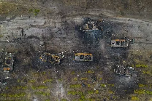 Destroyed Russian armored vehicles sit on the outskirts of Kyiv, Ukraine, March 31, 2022. In the year since Russia invaded Ukraine, disinformation and propaganda have emerged as key weapons in the Kremlin's arsenal. (AP Photo/Rodrigo Abd, File)