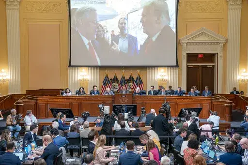 A image of former President Donald Trump talking to his chief of staff Mark Meadows is seen as Cassidy Hutchinson, former aide to Trump White House chief of staff Mark Meadows, testifies as the House select committee investigating the Jan. 6 attack on the U.S. Capitol holds a hearing at the Capitol in Washington, June 28, 2022. (Sean Thew/Pool via AP, File)