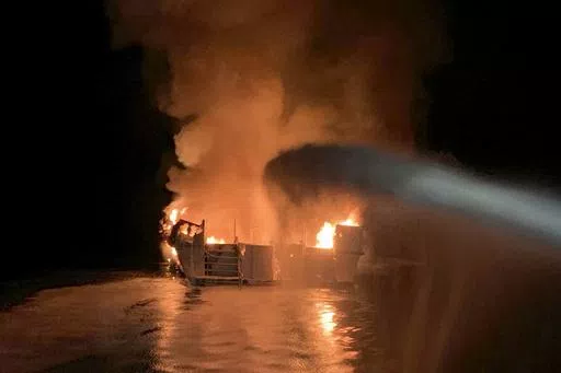 In this photo provided by the Ventura County Fire Department, VCFD firefighters respond to a fire aboard the Conception dive boat fire in the Santa Barbara Channel off the coast of Southern California on Sept. 2, 2019. A scuba dive boat captain is scheduled to be sentenced by a federal judge Thursday, May 2, 2024, on a conviction of criminal negligence after 34 people died in the fire aboard the vessel nearly five years ago. (Ventura County Fire Department via AP, File)