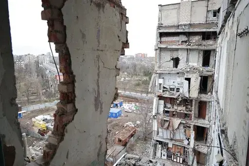 A view of an apartment building, damaged during a heavy fighting, in Mariupol, in Russian-controlled Donetsk region, eastern Ukraine, Thursday, Jan. 5, 2023. (AP Photo/Alexei Alexandrov)