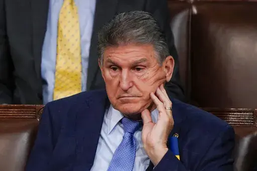 Sen. Joe Manchin, D-W.Va., listens as President Joe Biden delivers his first State of the Union address to a joint session of Congress, at the Capitol in Washington, Tuesday, March 1, 2022. (AP Photo/J. Scott Applewhite, Pool)