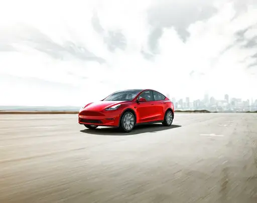 This photo provided by Toyota, shows the 2022 Tesla Model 3, an all-electric SUV that has an estimated maximum range of about 330 miles. (Courtesy of Tesla Motors via AP)