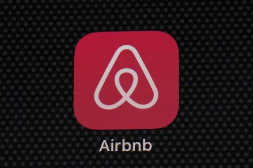 The Airbnb app icon is displayed on an iPad screen in Washington, D.C., on May 8, 2021. Airbnb says it's cracking down on fake listings, which are emerging as a major problem for customers of the short-term rental site. Airbnb said Wednesday Sept. 20 2023 it has removed 59,000 fake listings and blocked another 157,000 from joining the site this year. Fake listings and high cleaning fees are among several issues that customers are raising with Airbnb. (AP Photo/Patrick Semansky, File)