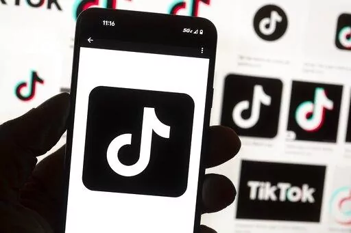 The TikTok logo is seen on a cell phone on Oct. 14, 2022, in Boston. The White House is giving all federal agencies 30 days to wipe TikTok off all government devices, as the Chinese-owned social media app comes under increasing scrutiny in Washington over security concerns. (AP Photo/Michael Dwyer, File)