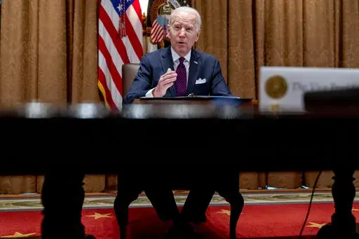 President Joe Biden meets with members of the Infrastructure Implementation Task Force to discuss the Bipartisan Infrastructure Law, in the Cabinet Room at the White House in Washington, Thursday, Jan. 20, 2022. (AP Photo/Andrew Harnik)