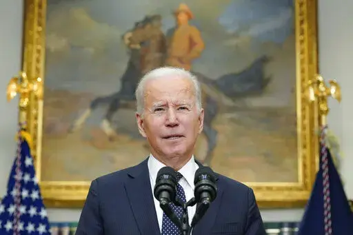 President Joe Biden speaks about Ukraine in the Roosevelt Room of the White House, Friday, Feb. 18, 2022, in Washington. (AP Photo/Alex Brandon)