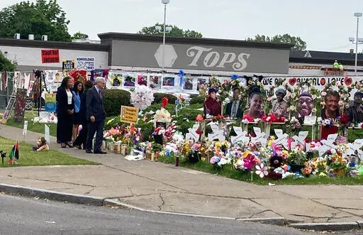 Attorney General Merrick Garland. visits the Tops Friendly Market grocery store in Buffalo, N.Y., on Wednesday, June 15, 2022, the site of a May 14 mass shooting in which 10 Black people were killed.  Garland was in Buffalo to announce federal hate crime charges against the 18-year-old shooter, Payton Gendron.  (AP Photo/Carolyn Thompson)