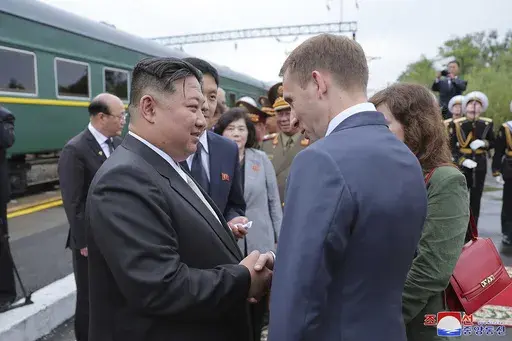 In this photo provided by the North Korean government, North Korea leader Kim Jong Un, front left, bids farewell to Russian Minister of Natural Resources and Ecology Alexander Kozlov, front right, at a station in Artyom, near Vladivostok, Russian Far East Sunday, Sept. 17, 2023. Independent journalists were not given access to cover the event depicted in this image distributed by the North Korean government. The content of this image is as provided and cannot be independently verified. Korean la