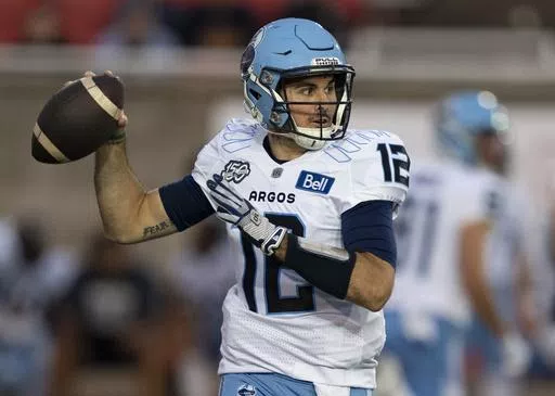 Toronto Argonauts quarterback Chad Kelly (12) throws against the Montreal Alouettes during the first half of a Canadian Football League game in Montreal, Friday, Sept. 15, 2023. The CFL suspended Toronto Argonauts quarterback Chad Kelly for at least nine regular-season games Tuesday, May 7, 2024, following its investigation into a lawsuit filed by a former strength and conditioning coach against both the player and club.(Christinne Muschi/The Canadian Press via AP, File)