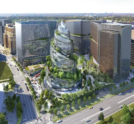 This artist rendering provided by Amazon shows the next phase of the company's headquarters redevelopment to be built in Arlington, Va.  The Arlington county Board gave approval Saturday, April 23, 2022 to Amazon's plans to build a unique, helix-shaped tower as the centerpiece of its emerging second headquarters in northern Virginia.(NBBJ/Amazon via AP)
