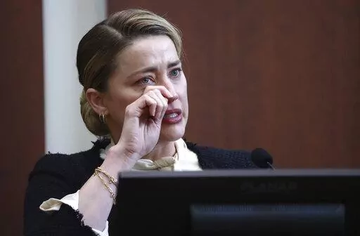 Actor Amber Heard testifies in the courtroom at the Fairfax County Circuit Court in Fairfax, Va., Thursday, May 5, 2022. Actor Johnny Depp sued his ex-wife actor Amber Heard for libel in Fairfax County Circuit Court after she wrote an op-ed piece in The Washington Post in 2018 referring to herself as a "public figure representing domestic abuse." (Jim Lo Scalzo/Pool Photo via AP)