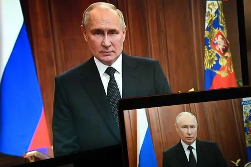 Russian President Vladimir Putin is seen on monitors as he addresses the nation after Yevgeny Prigozhin, the owner of the Wagner Group military company, called for armed rebellion and reached the southern city of Rostov-on-Don with his troops, in Moscow, Russia, Saturday, June 24, 2023. (Pavel Bednyakov, Sputnik, Kremlin Pool Photo via AP, File)