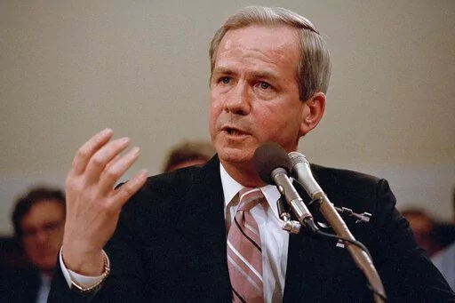 Former national security adviser Robert C. McFarlane gestures while testifying before the House-Senate panel investigating the Iran-Contra affair on Capitol Hill in Washington, May 13, 1987. McFarlane, a top aide to President Ronald Reagan who pleaded guilty to charges for his role in an illegal arms-for-hostages deal known as the Iran-Contra affair, died Thursday, May 12, 2022. He was 84. (AP Photo/Lana Harris, File)